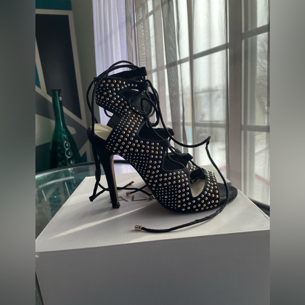 Worn once black rhinestones tie up heel!